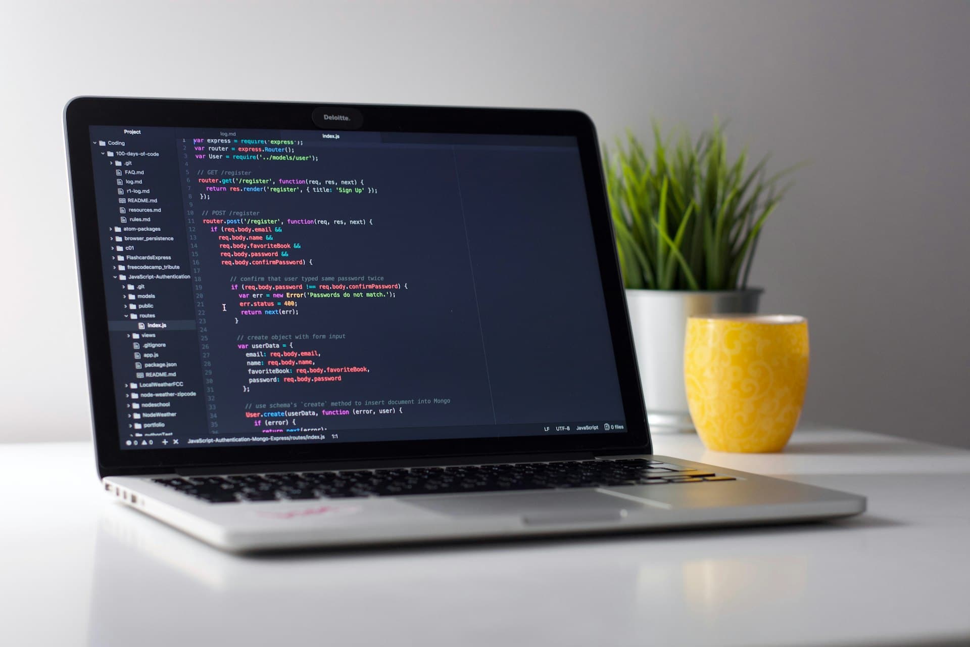 Student coding on a laptop